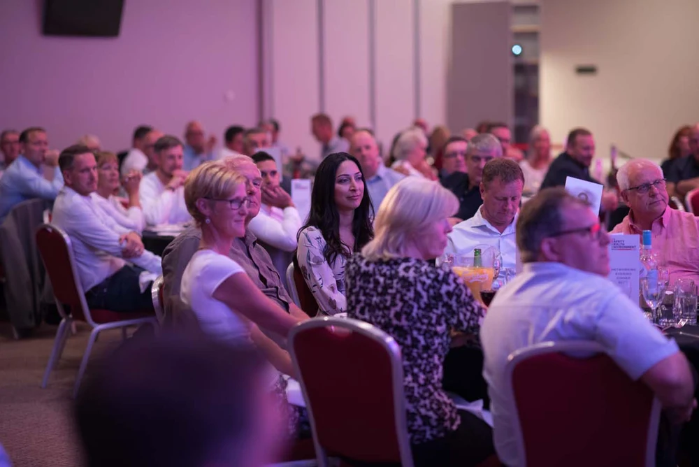Delegates listening together at a SHE Show conference
